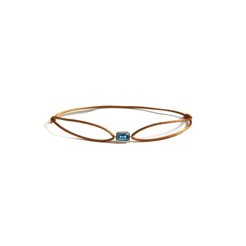 Pulseira em ouro amarelo, fio de seda e topázio azul - Emerald Cut